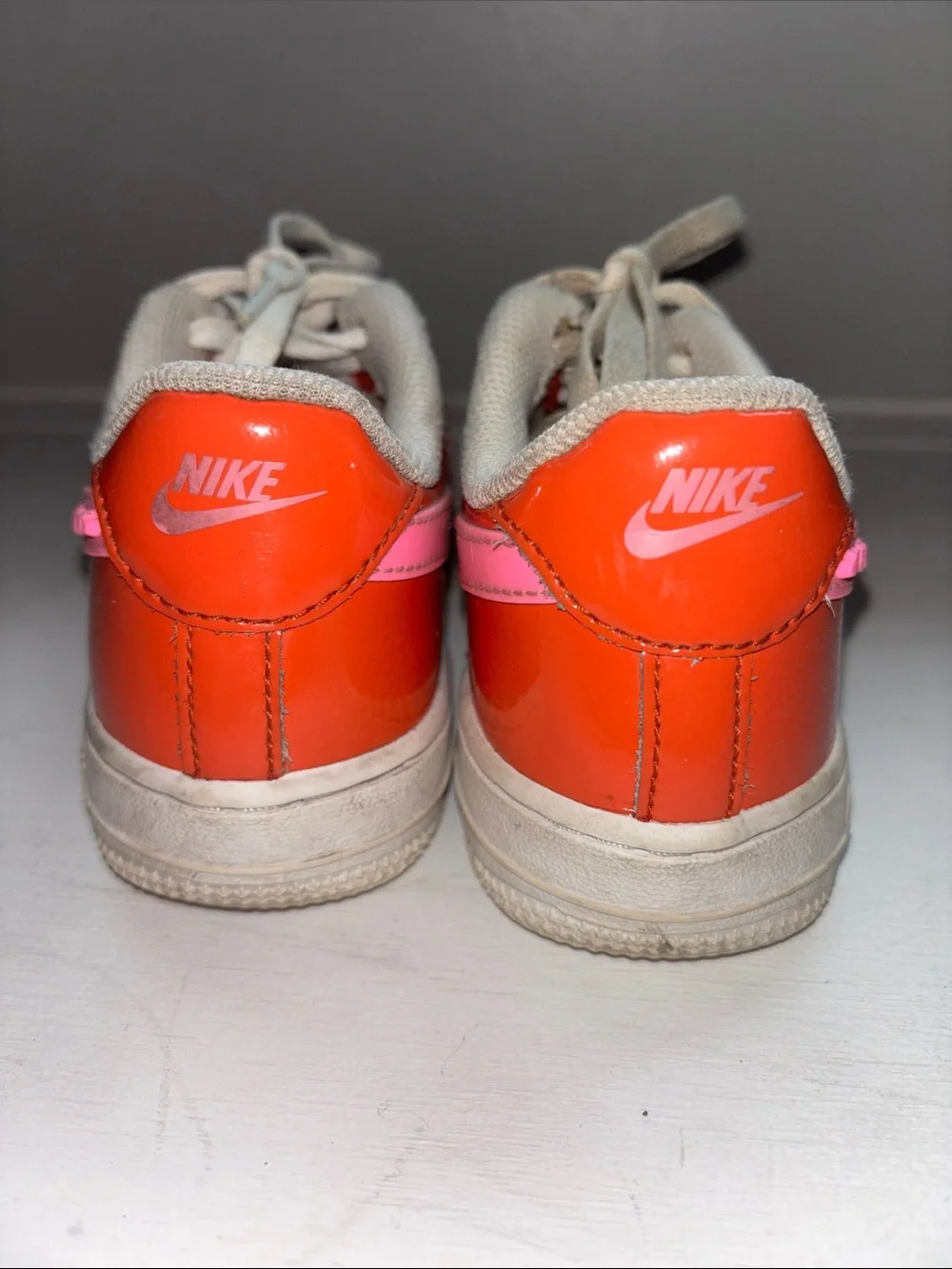 Nike Kids Low-Top Sneakers in Coral Red and Pink